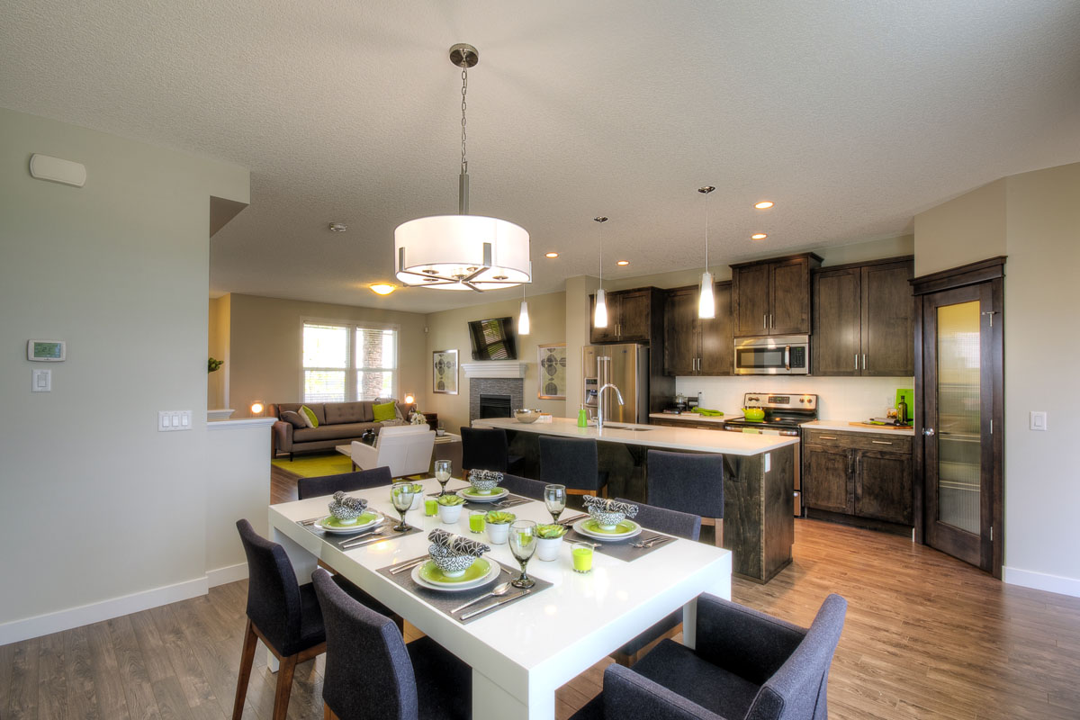 Wide angle shot of the dining room facing the kitchen in the Banbury II model home from Nuvista Homes.