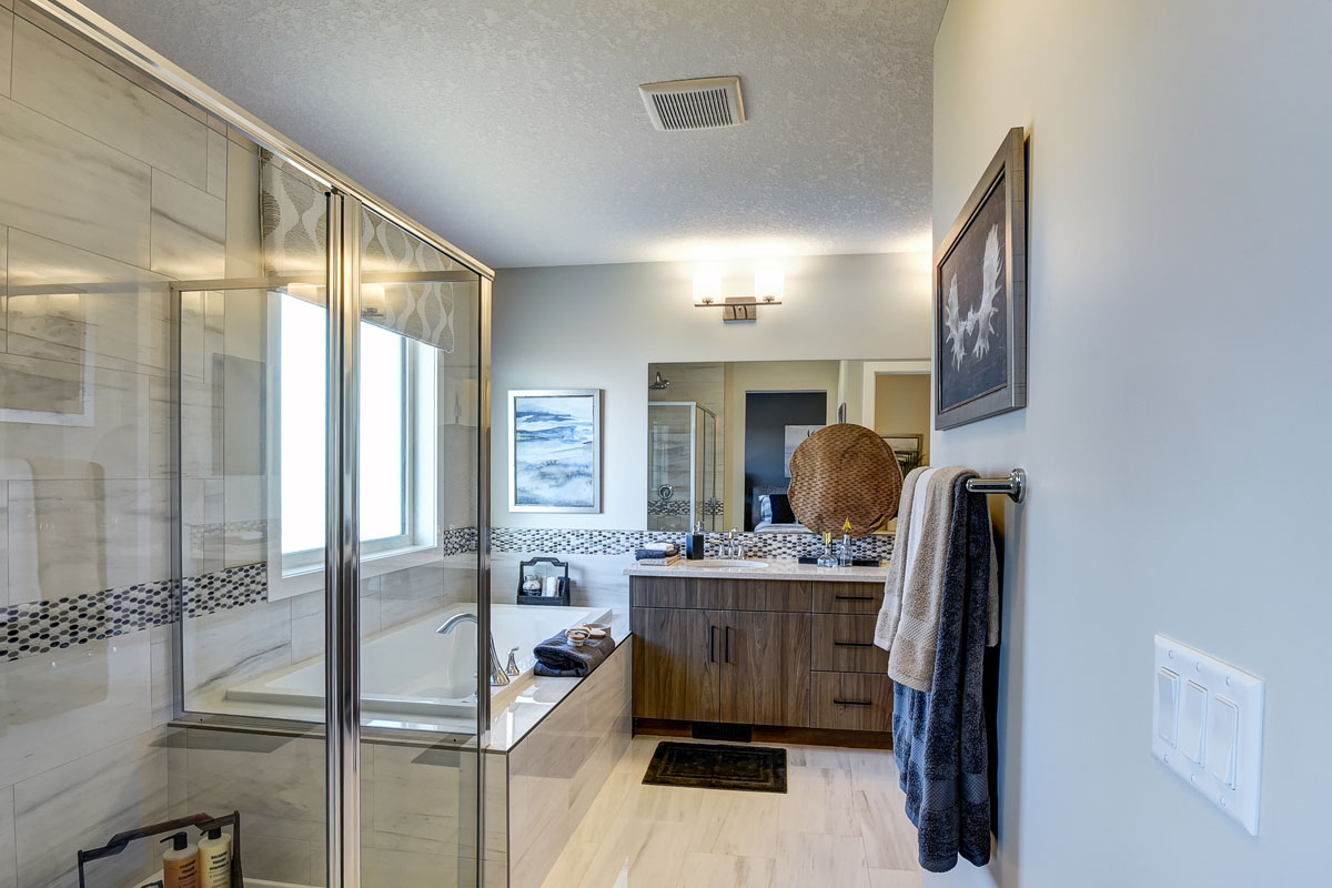 Master ensuite facing the shower and the vanity in the Hamilton Wil model home.