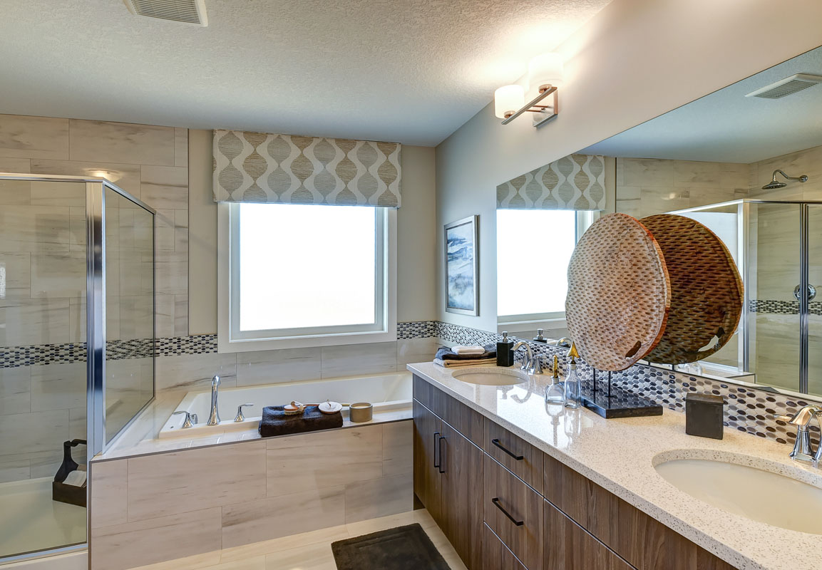 Master bedroom ensuite in the Hamilton Wil model home with large soaker tub.