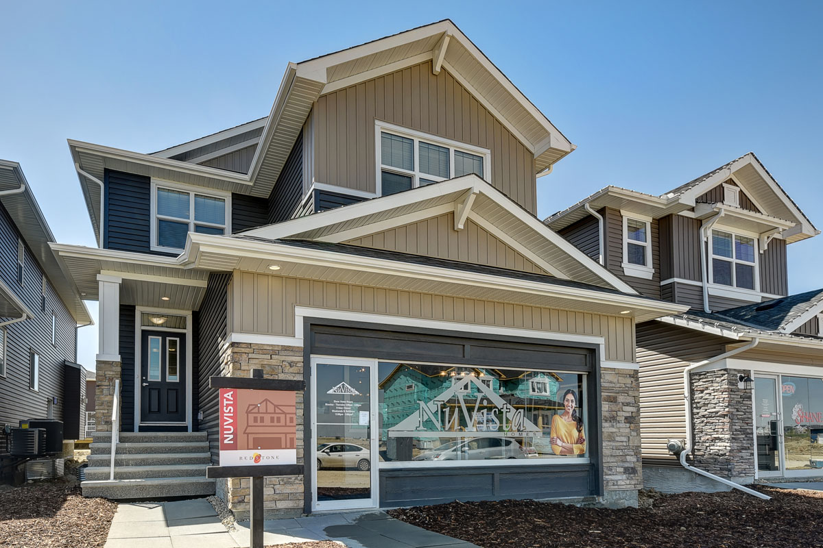 Close shot of the front exterior of the Inverness Red model home with Nuvista homes logo.
