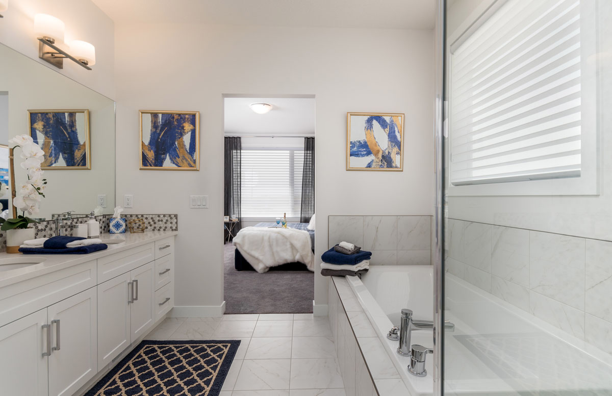Ensuite bathroom facing the side by side soaker tub and shower in the Wilshire model home.