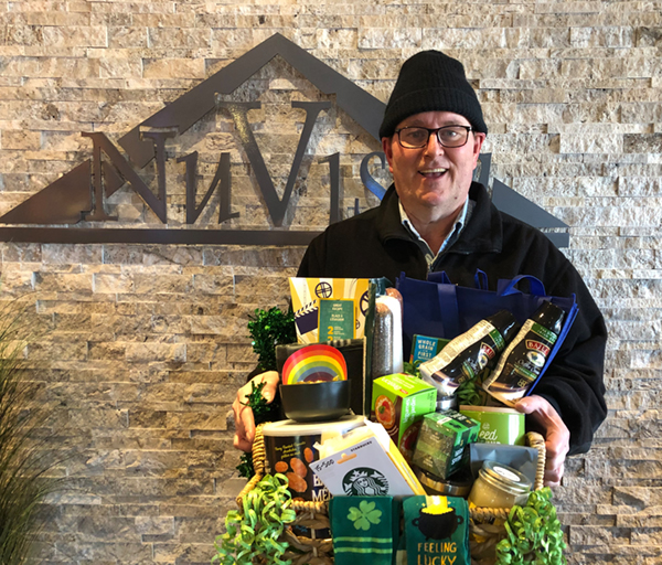 Gary with the March gift basket he won